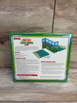Back of Lakeshore Sink My Sight-Words Game box, showing educational game details on wood floor