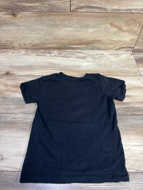 Front view of Hasbro Transformers 4th Birthday Shirt showcasing short sleeves in black, size 4T, on a wood grain background
