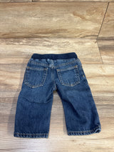 Back view of Baby Gap pull on straight baby jeans blue showing elastic waistband and back pockets on wood floor