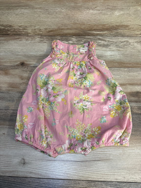 Pink floral baby romper with ruffle sleeves on wood background, gently used kids clothing