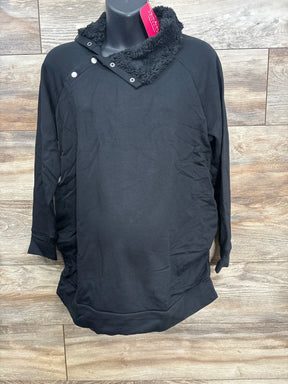 Black long-sleeve pullover with button and fleece collar on mannequin against wooden background