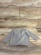 Back view of grey June & January button-front toddler shirt showing long sleeves and crew neckline on wood plank background