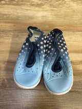 Top view of blue Fires Barefoot quick-dry toddler water shoes showcasing perforated upper, elastic gore, and white sole on wood floor