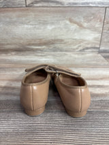 Rear view of tan children's tap shoes (size 9C) showcasing elastic strap and low heel with wood plank background