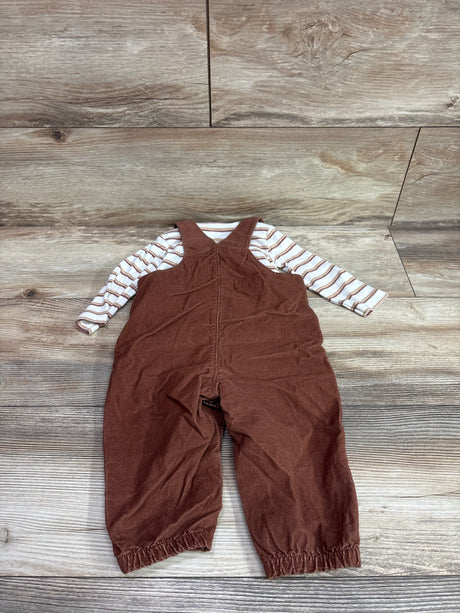 Top view of Just One You 2pc Turkey corduroy overalls set with brown overalls and striped shirt on wood flooring