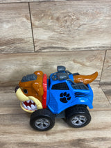 Blue and brown dog-themed toy car with black paw print, large wheels, and a fierce dog face