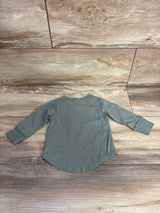 Back view of Little Bipsy newborn long sleeve tee size 0-3M showing curved hem and cuffed sleeves on wooden floor
