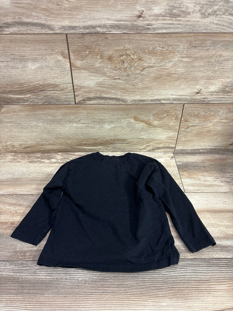 Black Zara long sleeve shirt for toddlers size 2-3T on a light wood background