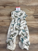 Two-pack 9-month baby sleepers with dinosaur prints, soft fleece baby pajamas on wood floor