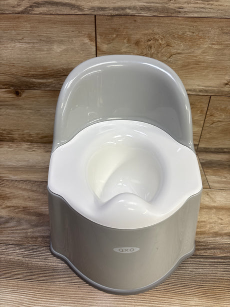 Front view of OXO Tot Potty Chair in Grey showcasing its white seat and built-in bowl on a wood-look floor