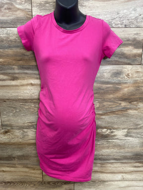 Bright pink maternity t-shirt with ruched side panels, displayed on mannequin against wood background