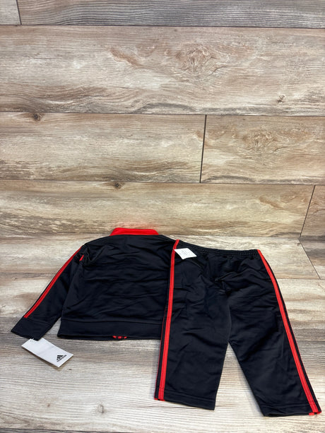 Black and red toddler tracksuit set with pants and jacket on wooden floor