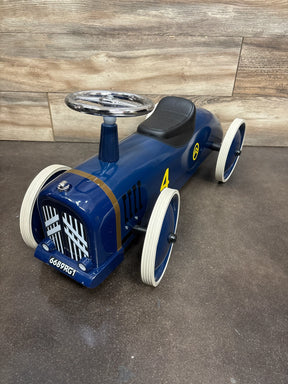 Blue vintage-style metal ride-on toy car with white wheels, black seat, and silver steering wheel