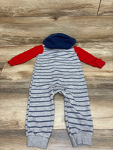 Front view of Carter’s gray hooded coverall, size 18 months, with navy stripes, red sleeves, and navy hood on wood