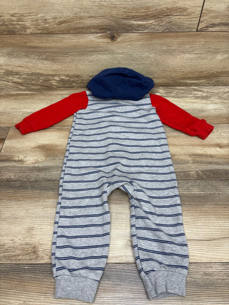 Front view of Carter’s gray hooded coverall, size 18 months, with navy stripes, red sleeves, and navy hood on wood