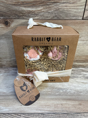 Rabbit Bear Organic baby gift set with pink booties in kraft box on wood background
