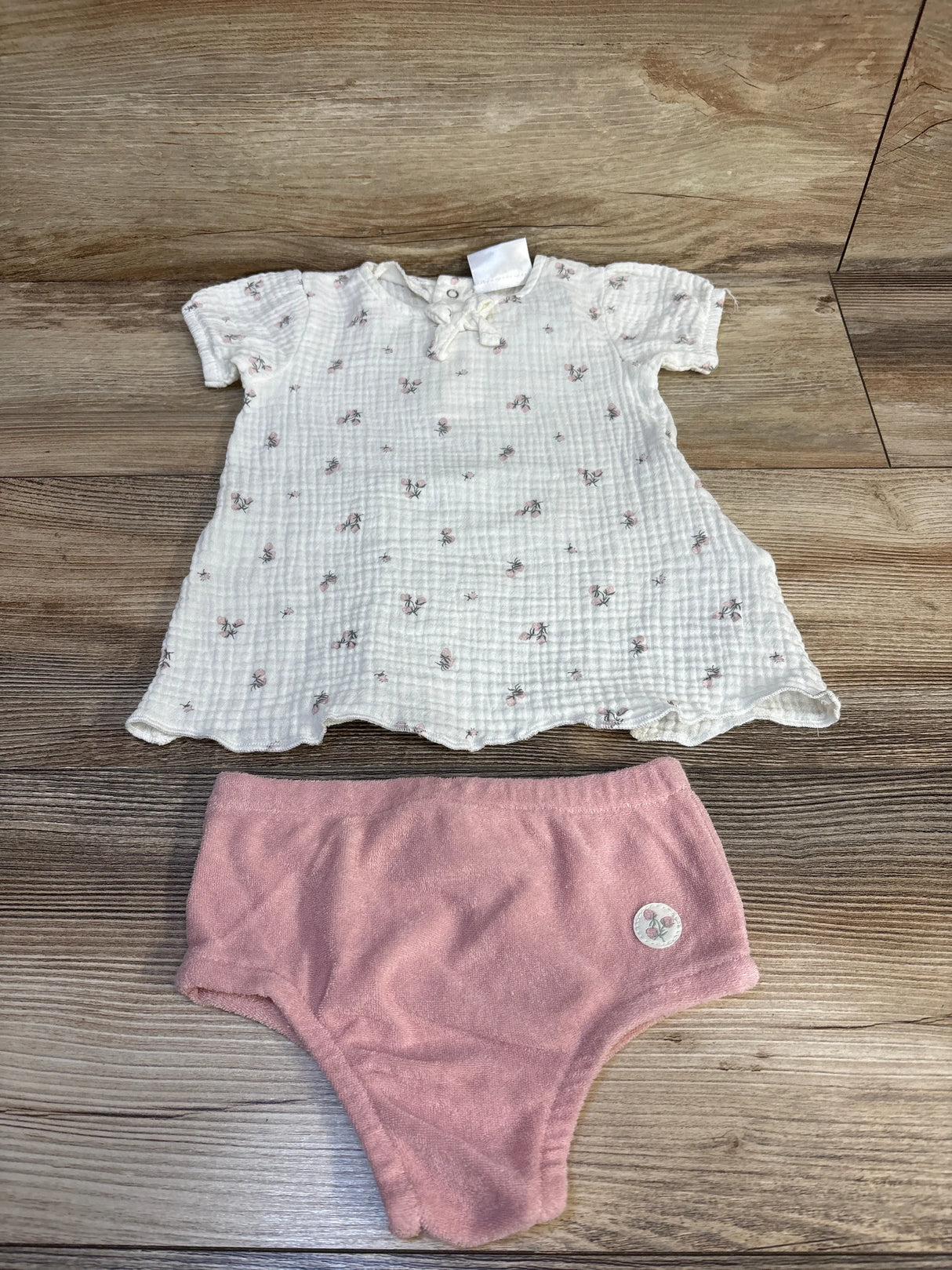 White floral baby dress with pink bloomers, soft cotton set for newborns, ideal for gentle everyday wear