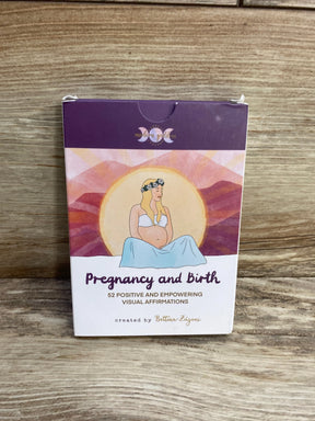 Front view of Pregnancy and Birth 52-card affirmation box showing illustrated pregnant woman and title with a wood tabletop background