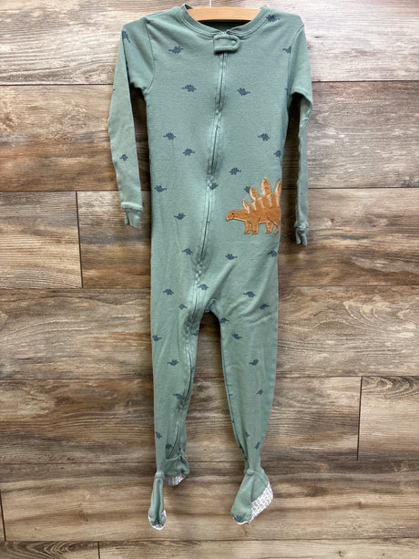 Front view of Carter’s green sleeper in size 5T with dinosaur print, appliqué, and full-length zipper on wood background