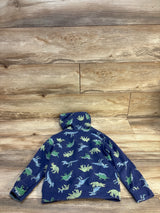 Blue kids hoodie with green and blue dinosaur print, laid on wood floor