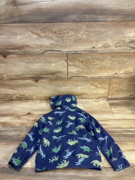 Blue kids hoodie with green and blue dinosaur print, laid on wood floor
