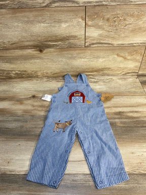 Blue striped baby overalls with barn and cow applique, farmhouse theme, wood background