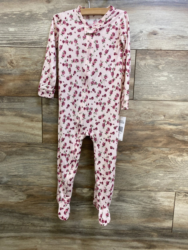 Front view of Betsey Johnson pink footed sleeper (3T) showcasing all-over rose print and front zipper on wooden background