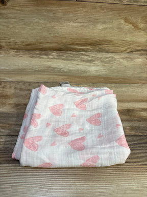 Folded view of GLLQUEN muslin bamboo swaddle blanket showcasing pink heart pattern on white fabric with wood background