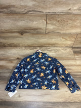 Kids denim jacket with cartoon dog print, laid flat on wood floor, resale clothing