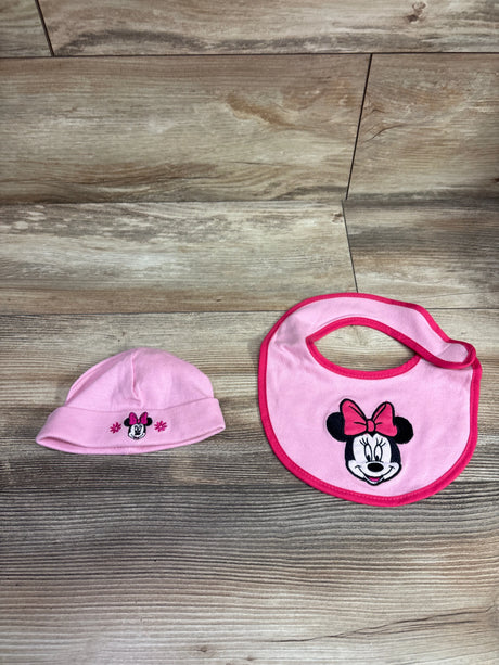 Disney Minnie Mouse pink 2-piece bib and hat set on a wooden background