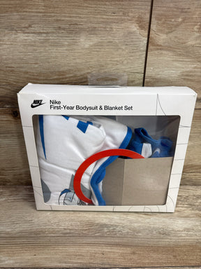 Nike First-Year Bodysuit & Blanket Set in white and blue, packaged in a white box with clear window