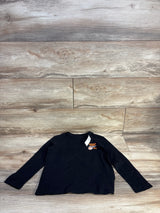 Black kids long sleeve shirt with National League '94 graphic, laid flat on wood floor