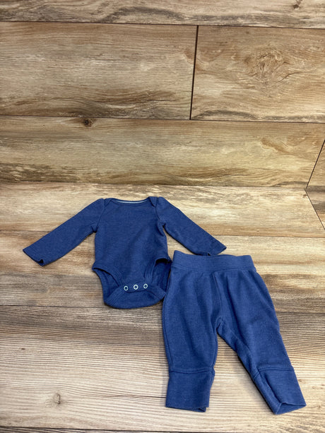 Top view of Cloud Island blue two-piece bodysuit and pants set showcasing long sleeves with a wood background