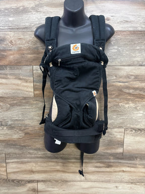Front view of Ergobaby Four Position 360 carrier with padded shoulder straps, zippered pocket and beige accents on wood background