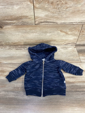 Navy blue baby hoodie with white streaks and zipper, displayed on wooden floor
