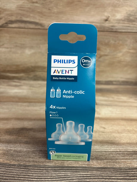 Front view of Philips Avent Natural Response nipples four-pack showing Flow 1, anti-colic packaging on a wood surface