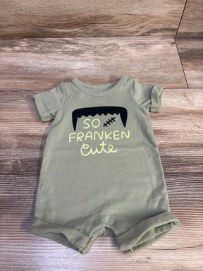 Front view of Cat and Jack So Franken Cute shortie romper showcasing green color, short sleeves, rolled cuffs, and graphic text
