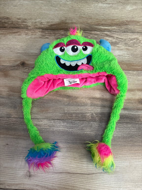 Green plush kids monster hat with three eyes, blue ears, and rainbow faux fur pom-poms