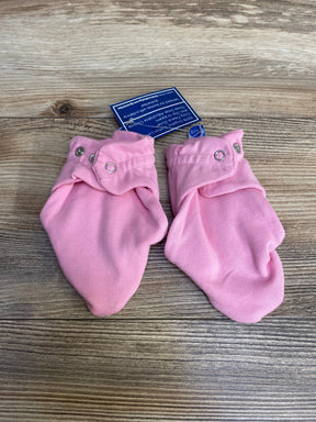 Top-down view of pink baby booties for 6-12 months showing snap-button ankle cuffs on wood background