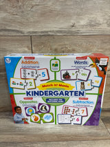 Front view of Match It! Mania Kindergarten box showing 100 matching pairs and learning categories on wood floor