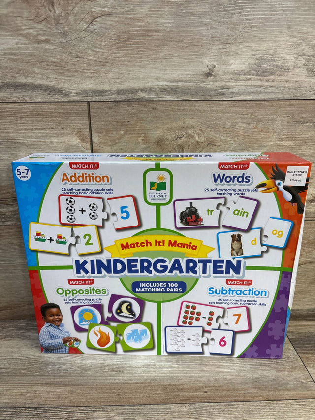 Front view of Match It! Mania Kindergarten box showing 100 matching pairs and learning categories on wood floor