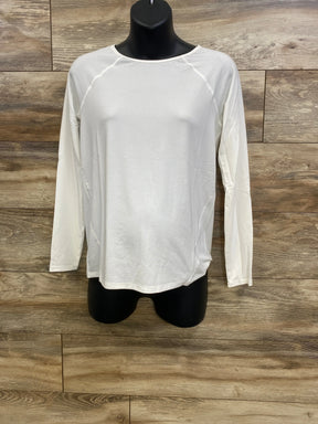 Front view of Gap maternity long-sleeve white Breathe shirt with raglan seams and relaxed fit on black mannequin against wood backdrop