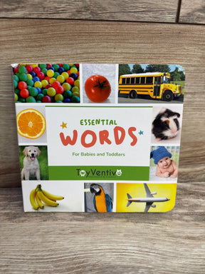 Front of Essential Words board book showing colorful collage cover with large ESSENTIAL WORDS title on wood surface