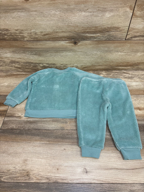 Back view of Pekkle 2-piece plush sweatshirt and pants set in blue, showing ribbed cuffs and waistband on a wood-look floor