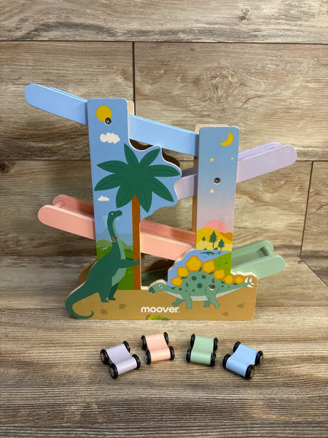 Wooden dinosaur ramp racer toy with pastel tracks and four small pastel cars on wood floor