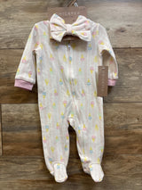 Front view of pink Chick Pea sleeper and headband set showcasing pastel ice cream print and zipper on wood background