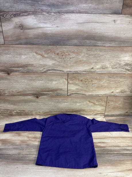 Back view of a purple Johnnie Lene long sleeve button-up dress shirt for toddlers on a wood background.