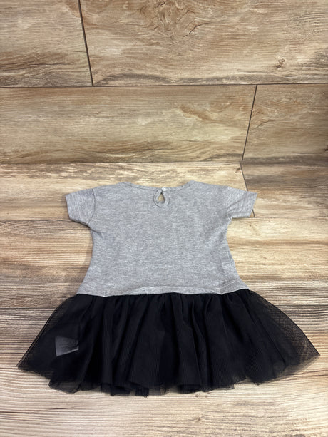Flat lay of NHL Golden Knights tulle T-shirt dress in grey, size 2T, with a black tulle skirt on wood flooring