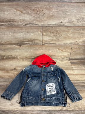 Kids denim jacket with red hood, front pockets, patch and zipper accents, on wood floor