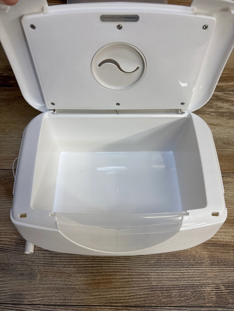White baby wipe warmer with open lid on wooden surface